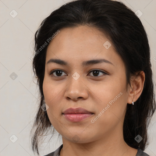 Joyful latino young-adult female with medium  brown hair and brown eyes