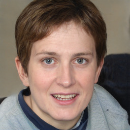 Joyful white young-adult female with medium  brown hair and blue eyes