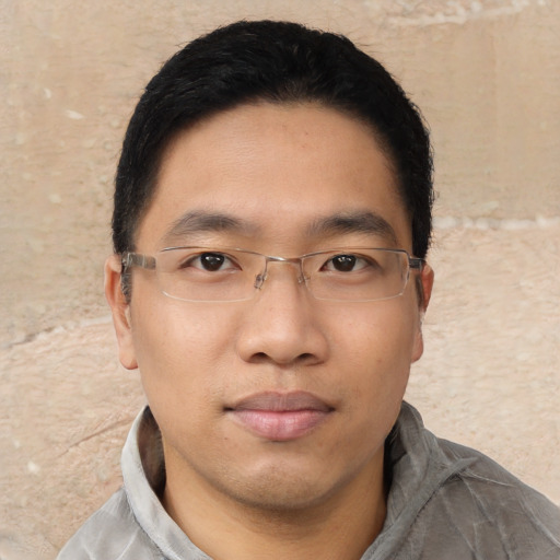 Neutral asian young-adult male with short  black hair and brown eyes