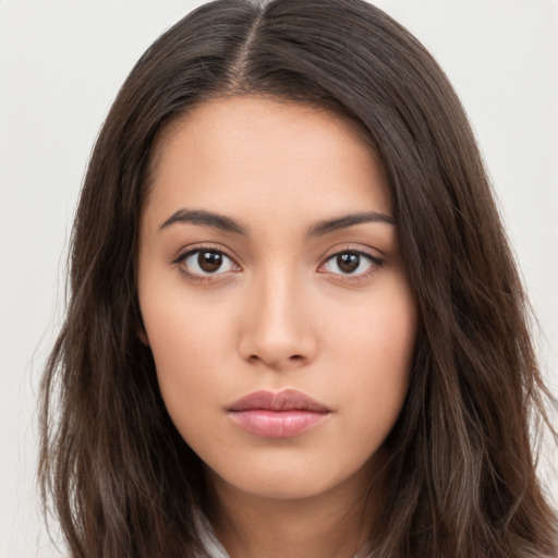 Neutral white young-adult female with long  brown hair and brown eyes