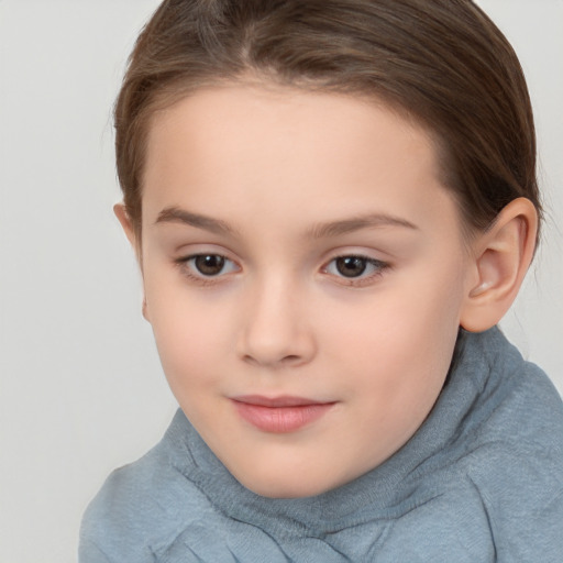 Joyful white child female with short  brown hair and brown eyes