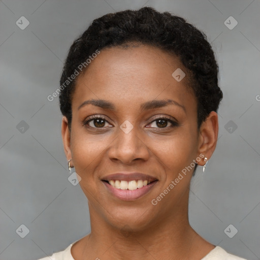 Joyful black young-adult female with short  brown hair and brown eyes