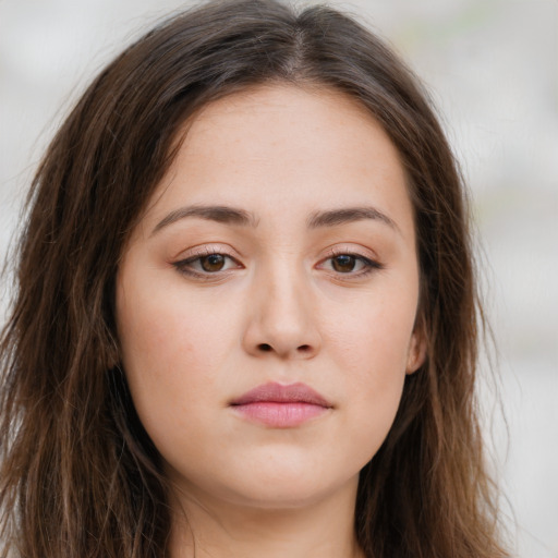 Neutral white young-adult female with long  brown hair and brown eyes