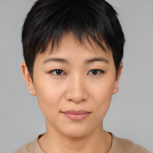 Joyful asian young-adult female with short  brown hair and brown eyes