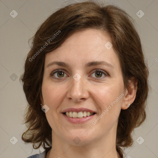 Joyful white young-adult female with medium  brown hair and green eyes