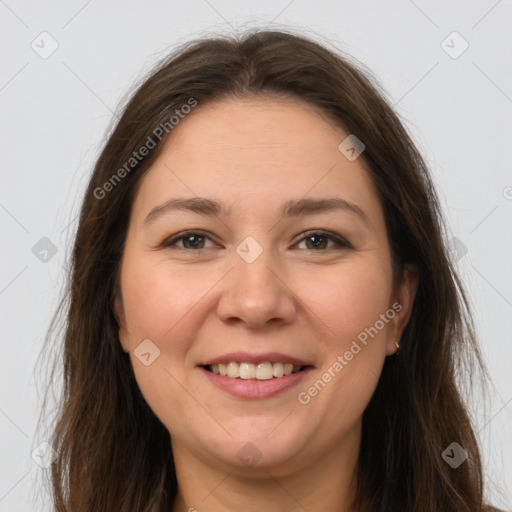 Joyful white young-adult female with long  brown hair and brown eyes