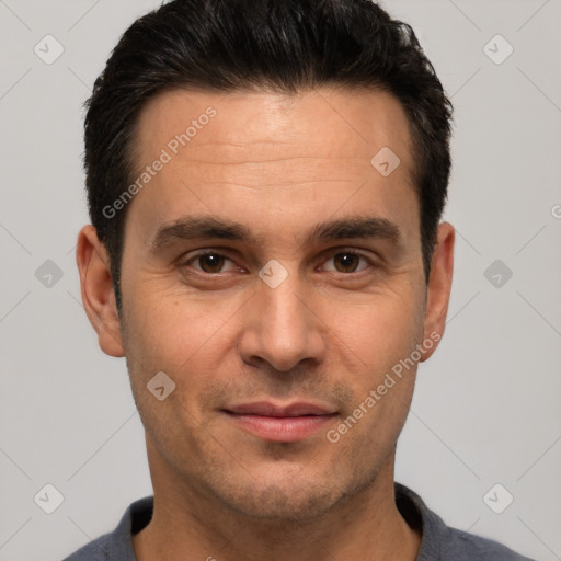 Joyful white young-adult male with short  black hair and brown eyes