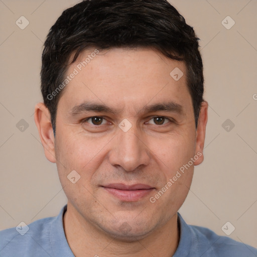 Joyful white adult male with short  brown hair and brown eyes