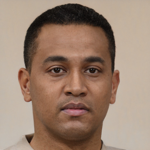 Neutral latino young-adult male with short  brown hair and brown eyes