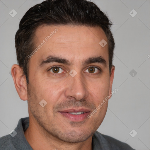 Joyful white adult male with short  brown hair and brown eyes