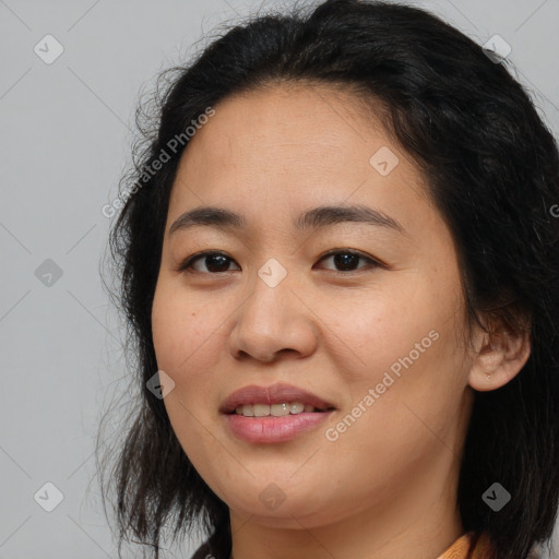 Joyful asian young-adult female with medium  brown hair and brown eyes