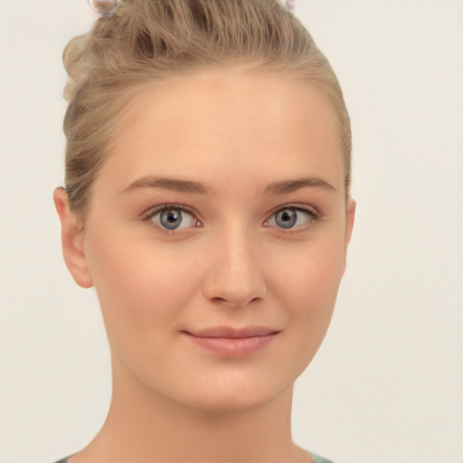 Joyful white child female with short  brown hair and brown eyes