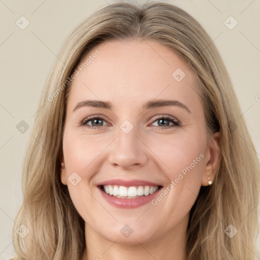 Joyful white young-adult female with long  brown hair and green eyes