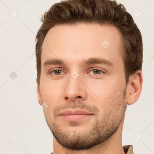 Joyful white young-adult male with short  brown hair and brown eyes