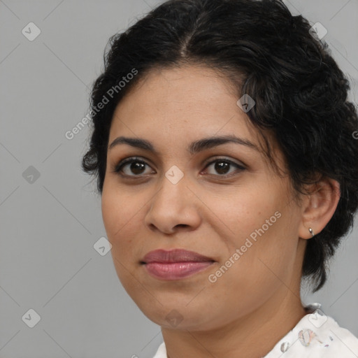 Joyful latino adult female with medium  brown hair and brown eyes