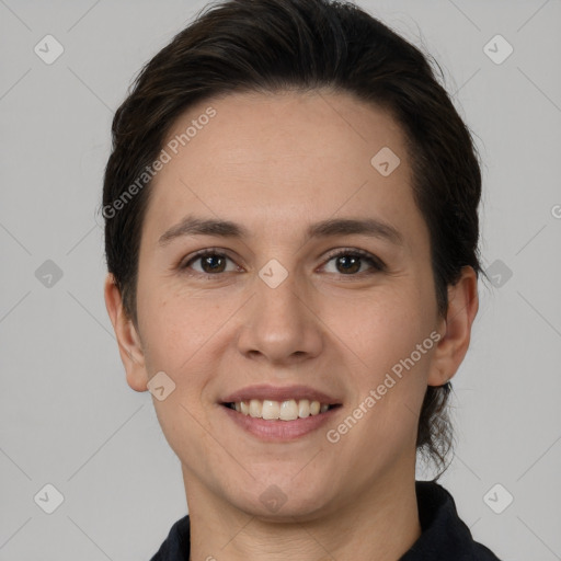 Joyful white young-adult female with short  brown hair and brown eyes