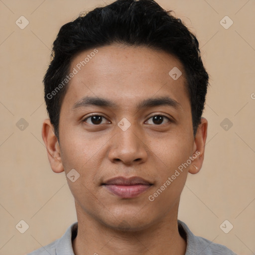 Joyful latino young-adult male with short  black hair and brown eyes