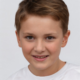 Joyful white child male with short  brown hair and brown eyes