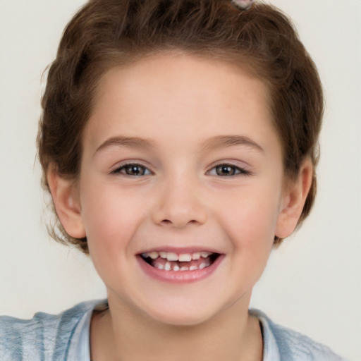 Joyful white child female with short  brown hair and brown eyes