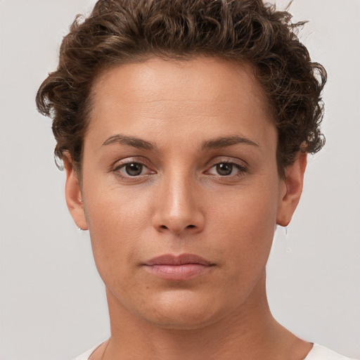 Neutral white young-adult female with short  brown hair and brown eyes