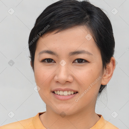 Joyful asian young-adult female with short  brown hair and brown eyes