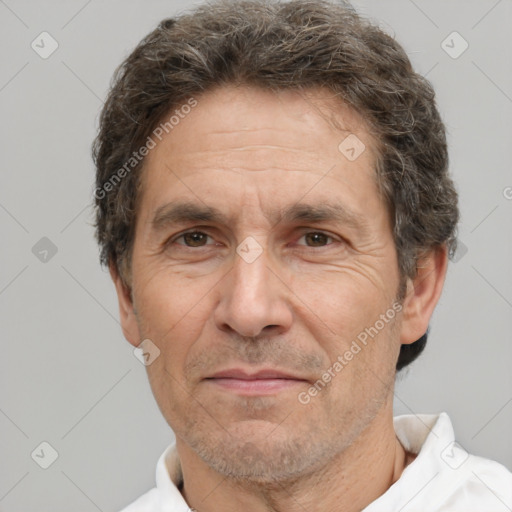 Joyful white middle-aged male with short  brown hair and brown eyes