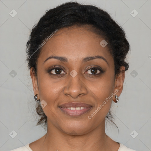 Joyful black adult female with medium  brown hair and brown eyes