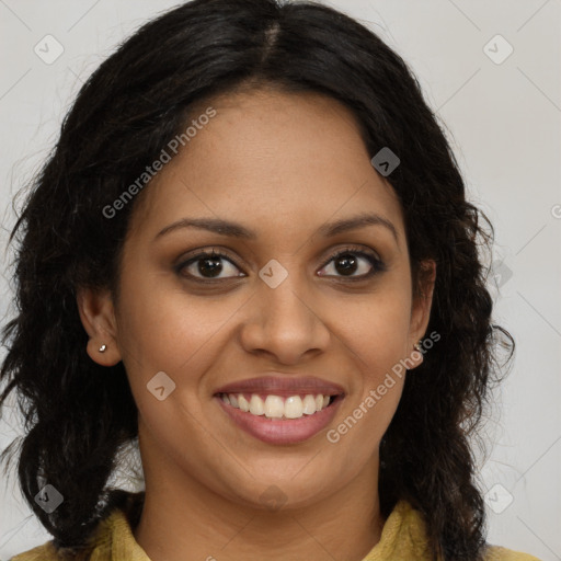 Joyful black young-adult female with long  brown hair and brown eyes