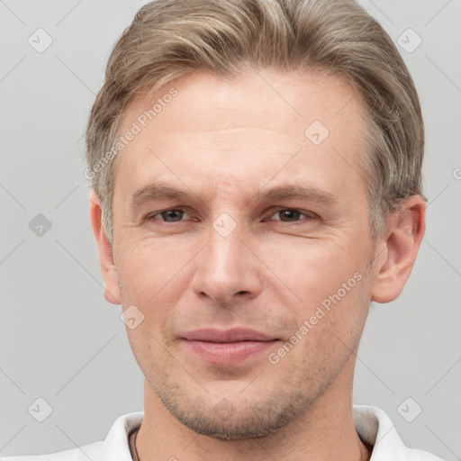 Joyful white adult male with short  brown hair and grey eyes