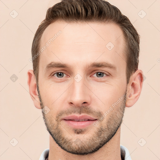 Joyful white young-adult male with short  brown hair and brown eyes