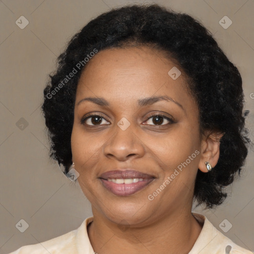 Joyful black adult female with medium  black hair and brown eyes