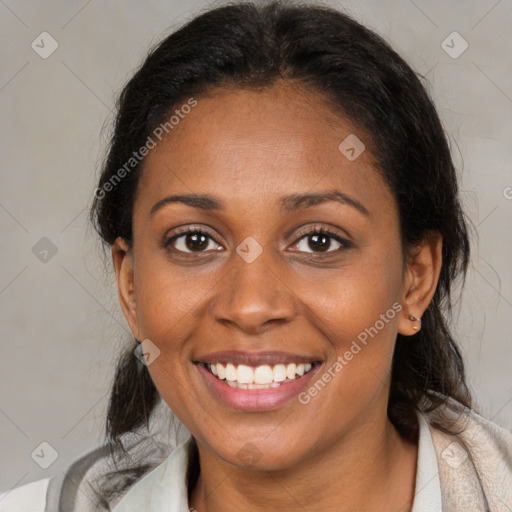 Joyful black young-adult female with medium  brown hair and brown eyes