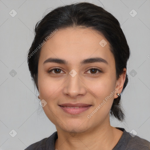 Joyful latino young-adult female with medium  black hair and brown eyes