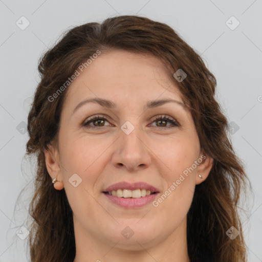 Joyful white adult female with long  brown hair and brown eyes