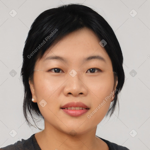 Joyful asian young-adult female with medium  black hair and brown eyes