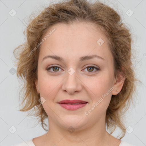 Joyful white young-adult female with medium  brown hair and green eyes