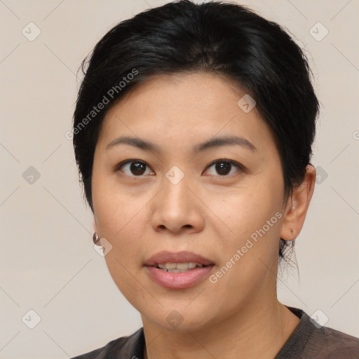 Joyful asian young-adult female with medium  black hair and brown eyes