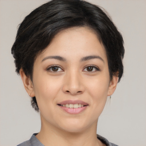 Joyful asian young-adult female with medium  black hair and brown eyes