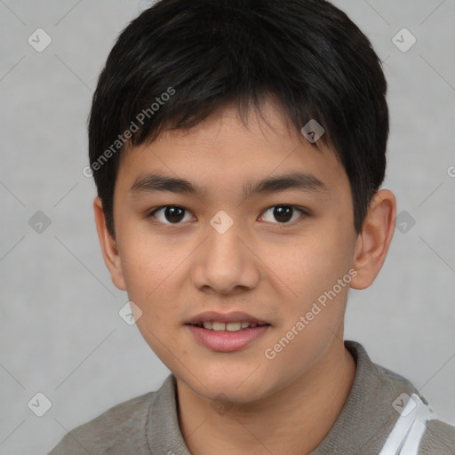 Joyful asian child male with short  brown hair and brown eyes