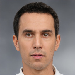 Neutral white young-adult male with short  black hair and brown eyes