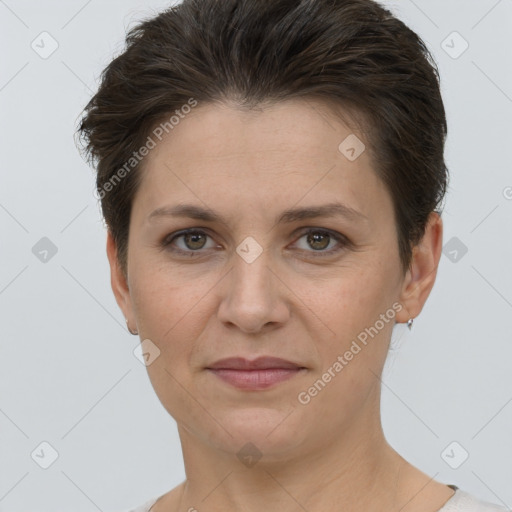 Joyful white adult female with short  brown hair and brown eyes