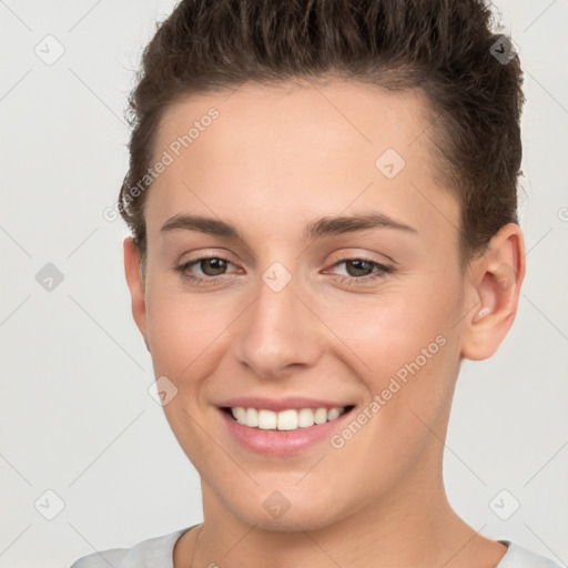 Joyful white young-adult female with short  brown hair and brown eyes