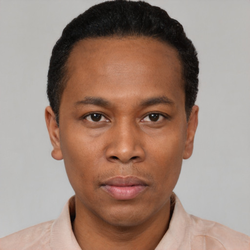 Neutral black young-adult male with short  black hair and brown eyes
