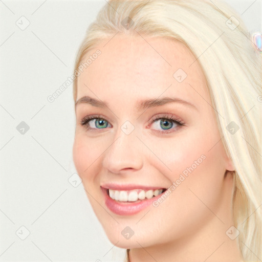 Joyful white young-adult female with long  brown hair and blue eyes