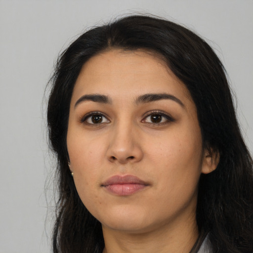 Neutral latino young-adult female with long  black hair and brown eyes