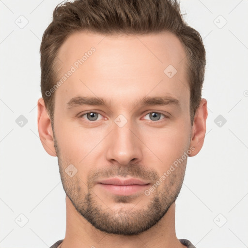 Joyful white young-adult male with short  brown hair and grey eyes