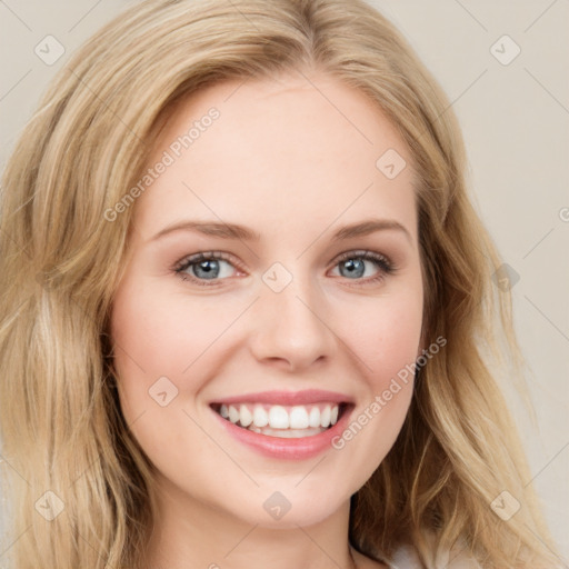 Joyful white young-adult female with long  brown hair and blue eyes