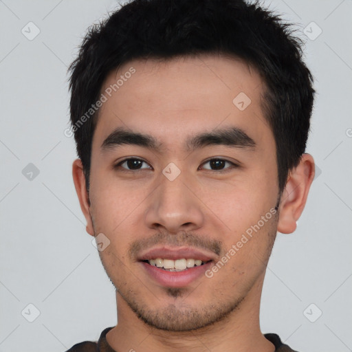 Joyful white young-adult male with short  black hair and brown eyes