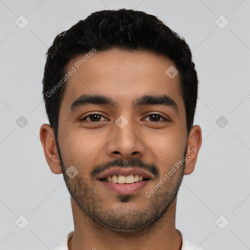 Joyful latino young-adult male with short  black hair and brown eyes