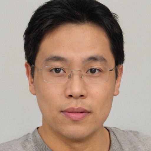 Neutral asian young-adult male with short  brown hair and brown eyes